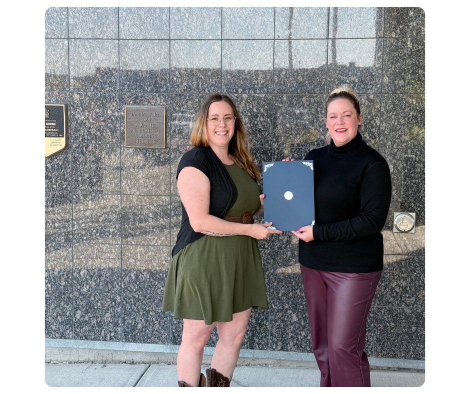 mitoAmbassador Alyson Maxwell and Mayor Ken Johnston of Red Deer with the World Mitochondrial Disease Week Proclamation 2025