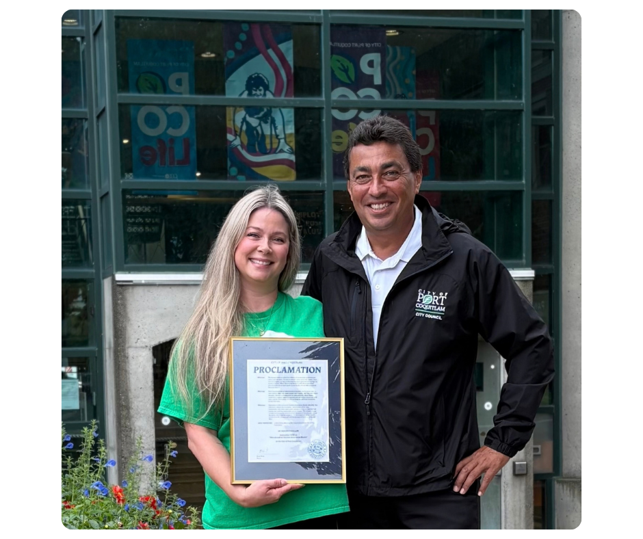 mitoScholar Jodi and her sister Erica pose with the Corner Brook Proclamation for World Mitochondrial Disease Week 2025 